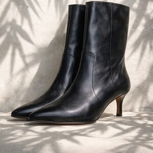 Sleek Black Leather Heeled Boots